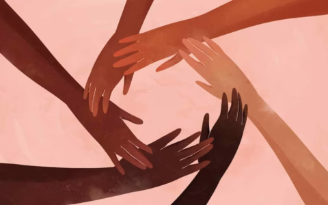 Illustration of six hands of varying skin tones forming a circle on a light pink background, symbolising unity, diversity, and inclusion.
